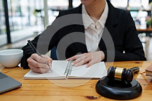 Lawyer business woman working or reading lawbook in office workplace for consultant lawyer concept