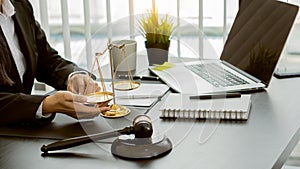 Lawyer Consulting Businessman in Office with Judge Hammer and Justice Scales with Laptop, Attorney Concept and Legal Consulting