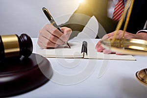 Lawyer Detail of a judge sitting at his desk, studying new laws and legislation and taking notes