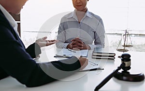 Lawyer is explaining about the wrongdoing laws regarding fraud to the client at the office