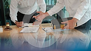 Lawyer give advice to man. businessman discussing legal legislation at law firm. judge team meeting at courtroom