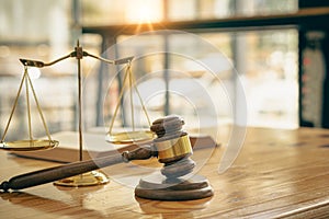 Lawyer Hammer Justice Scales Have At Law Firm In The Background concept of law and justice Judge`s Mallet Place for printing. Oran