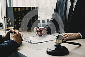 Lawyer hand holding pen and providing legal consult business dispute to the man
