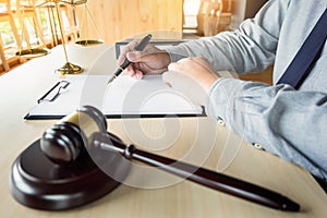 lawyer hand writes the document in court & x28;justice, law& x29;