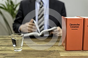 Lawyer in his office with books