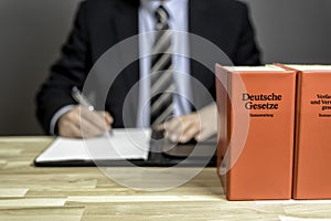 Lawyer in his office with books