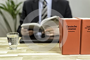 Lawyer in his office with books