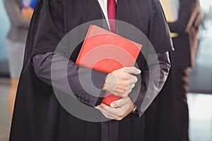 Lawyer holding a law book