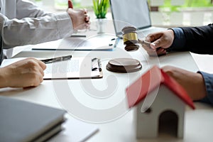 Lawyer insurance broker consulting giving legal advice to couple customer about buying renting house. financial advisor with