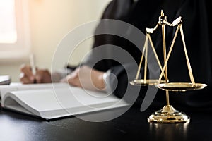 lawyer judge reading documents at desk in courtroom