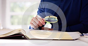 Lawyer Law Book With Magnifying Glass