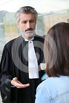 Lawyer meeting client outside the court