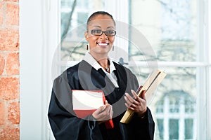 Lawyer in office with law book and Dossier