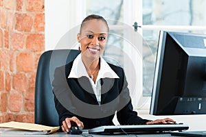 Lawyer in office sitting on the computer