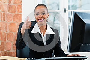 Lawyer in office sitting on the computer