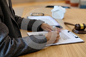 lawyer read contract. woman reviewing mortgage loan document wit