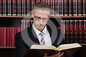 Lawyer Reading Book At Courtroom