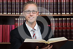 Lawyer Reading Book At Courtroom