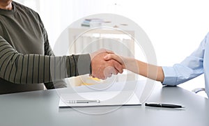 Lawyer shaking hands with client