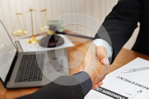 The lawyer shook hands with the client after completing the consultation in the case