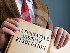 Lawyer shows ADR alternative dispute resolution methods in the book. photo