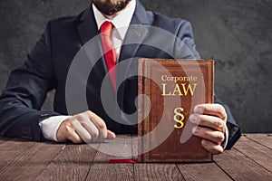Lawyer shows statute book of law