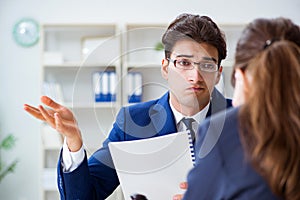 The lawyer talking to his client in office
