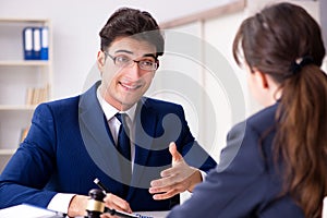 The lawyer talking to his client in office