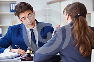 The lawyer talking to his client in office