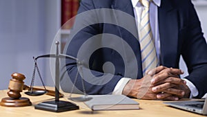 lawyer used his hands together as sign to pray to God based on his faith and power of faith in God and to pray that he would be