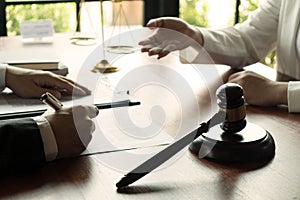 Lawyer working with contract client on the table in office. consultant lawyer, attorney, court judge, concept