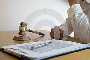 Lawyer working with contract papers on the table in office. consultant lawyer, attorney, court judge, concept