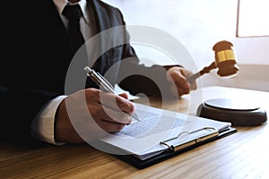 Lawyer working with contract papers on the table in office. consultant lawyer, attorney, court judge, concept