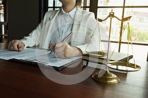 Lawyer working with contract papers on the table in office. consultant lawyer, attorney, court judge, concept