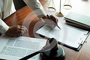 Lawyer working with contract papers on the table in office. consultant lawyer, attorney, court judge, concept