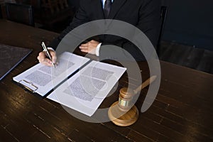 Lawyer working with contract papers on the table in office. consultant lawyer, attorney, court judge, concept