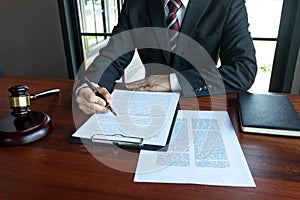 Lawyer working with contract papers on the table in office. consultant lawyer, attorney, court judge, concept