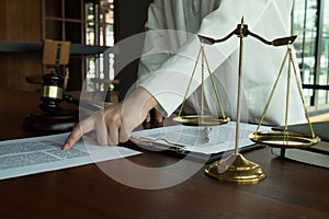 Lawyer working with contract papers on the table in office. consultant lawyer, attorney, court judge, concept