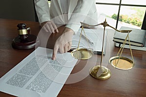 Lawyer working with contract papers on the table in office. consultant lawyer, attorney, court judge, concept