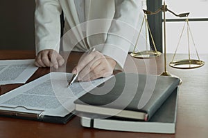 Lawyer working with contract papers on the table in office. consultant lawyer, attorney, court judge, concept