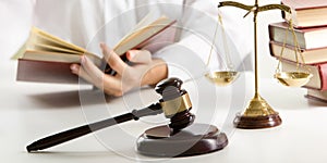 Lawyer working with contract papers and wooden gavel on tabel in courtroom. justice and law ,attorney, court judge