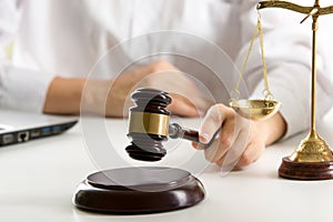 Lawyer working with contract papers and wooden gavel on tabel in courtroom. justice and law ,attorney, court judge