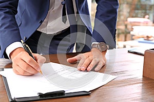 Lawyer working with documents at table