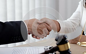 Lawyers or counselors join hands with clients to congratulate the end of the case by the company