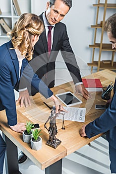 Lawyers discussing contract in office photo