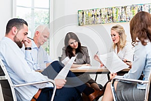 Lawyers having team meeting in law firm