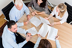 Lawyers having team meeting in law firm