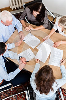 Lawyers having team meeting in law firm