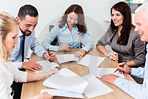 Lawyers having team meeting in law firm