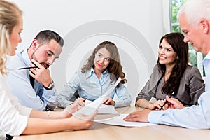 Lawyers having team meeting in law firm
